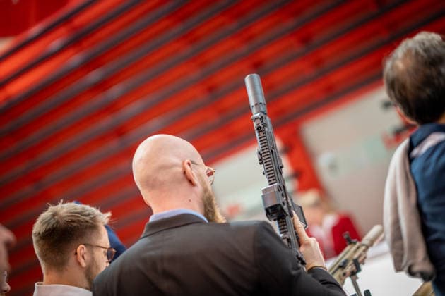 A view of the exhibition halls and the fairgrounds; the Heckler & Koch booth featuring handguns and machine guns; the Euro Defense Expo 2026 defense trade show in Essen, Germany; Essen, North Rhine-Westphalia, Germany; fairgrounds