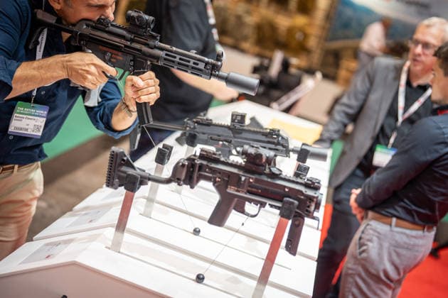 A view of the exhibition halls and the fairgrounds; the Heckler & Koch booth featuring handguns and machine guns; the Euro Defense Expo 2026 defense trade show in Essen, Germany; Essen, North Rhine-Westphalia, Germany; the fairgrounds