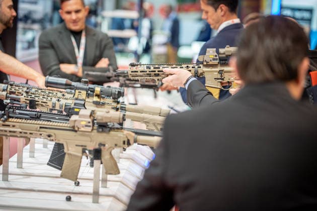 A view of the exhibition halls and the fairgrounds; the Heckler & Koch booth featuring handguns and machine guns; the Euro Defense Expo 2026 defense trade show in Essen, Germany; Essen, North Rhine-Westphalia, Germany; the fairgrounds