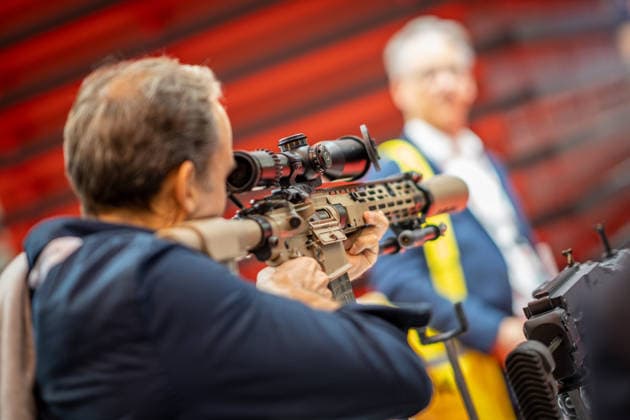 A view of the exhibition halls and the fairgrounds; the Heckler & Koch booth featuring handguns and machine guns; the Euro Defence Expo 2026 defense trade show in Essen, Germany; Essen, North Rhine-Westphalia, Germany; the fairgrounds