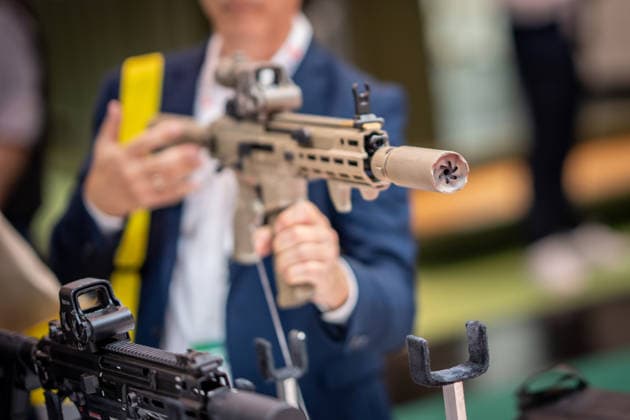 A view of the exhibition halls and the fairgrounds; the Heckler & Koch booth featuring handguns and machine guns; the Euro Defence Expo 2026 defense trade show in Essen, Germany; Essen, North Rhine-Westphalia, Germany; the fairgrounds