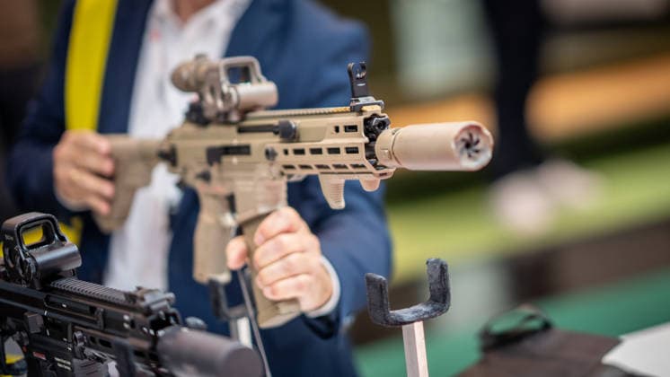 A view of the exhibition halls and the fairgrounds; the Heckler & Koch booth featuring handguns and machine guns; the Euro Defence Expo 2026 defense trade show in Essen, Germany; Essen, North Rhine-Westphalia, Germany; the fairgrounds