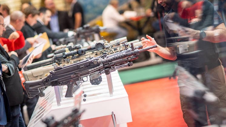 A view of the exhibition halls and the fairgrounds; the Heckler & Koch booth featuring handguns and machine guns; the Euro Defense Expo 2026 defense trade show in Essen, Germany; Essen, North Rhine-Westphalia, Germany; the fairgrounds