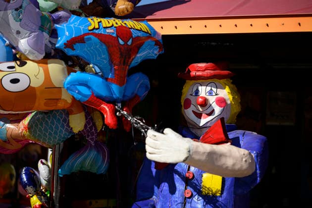 Papier-mâché clown with balloons at the Oidn Wiesn Oktoberfest, Munich, September 23, 2026