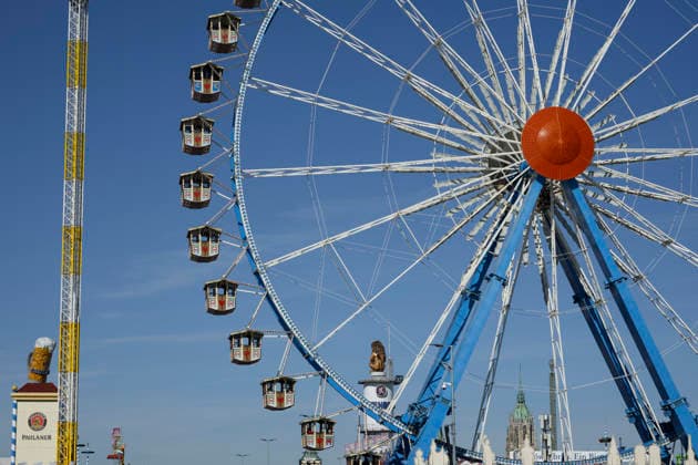 The Paulaner Tower with a beer stein, the Willenborg Ferris wheel, and the Löwenbräu Tower with a lion at the Oktoberfest (Wiesn) in Munich, September 23, 2026