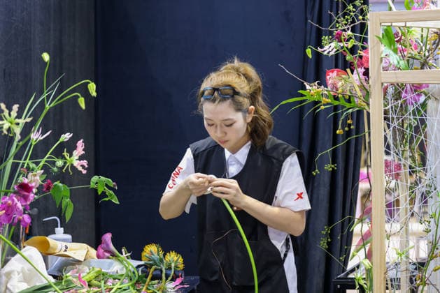 SHANGHAI, CHINA - SEPTEMBER 23: Zhang Mingtian of Team China competes in the Floristry event during WorldSkills Shanghai 2026 on September 23, 2026 in Shanghai, China. The 48th World Skills Competition officially opened in Shanghai, featuring contestants from around the world demonstrating their vocational skills.  Copyright: xVCGx 111669072215