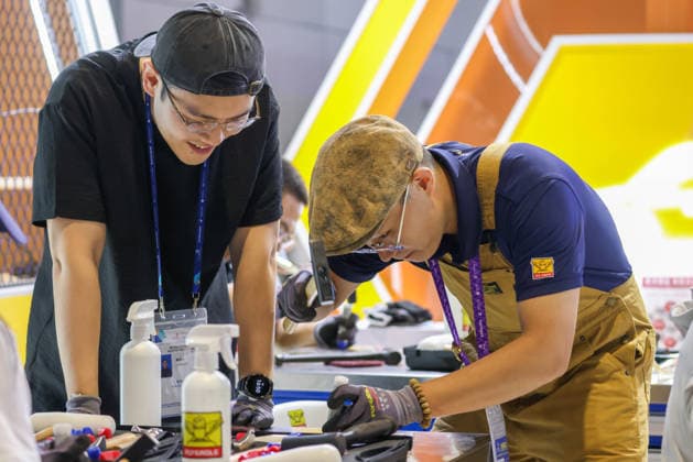 SHANGHAI, CHINA - SEPTEMBER 23: Spectators experience metal printmaking at the venue of the 48th WorldSkills Competition on September 23, 2026 in Shanghai, China. The 48th WorldSkills Competition officially opened in Shanghai, bringing together skilled competitors from around the world.  Copyright: xVCGx 111669072218