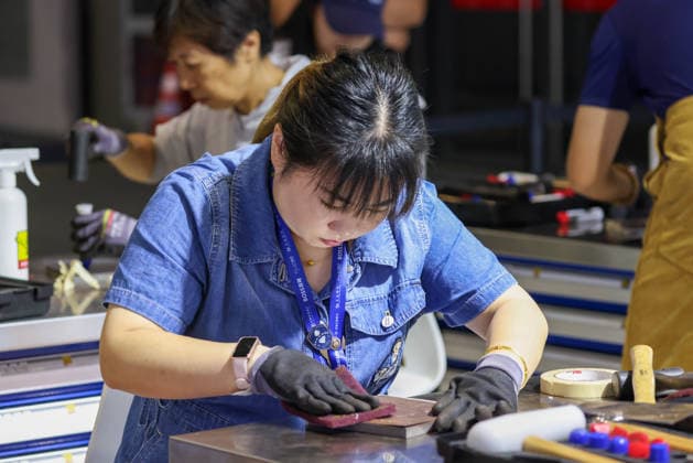 SHANGHAI, CHINA - SEPTEMBER 23: Spectators experience metal printmaking production during the 48th World Skills Competition on September 23, 2026 in Shanghai, China. The 48th edition of the global vocational skills tournament officially opened in Shanghai.  Copyright: xVCGx 111669072219