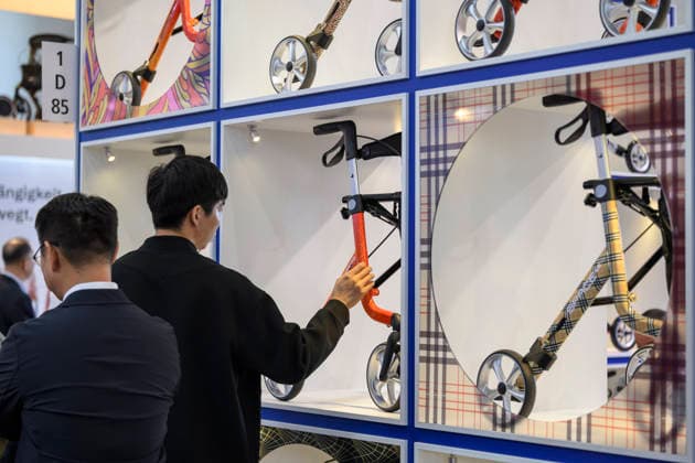 Feature: Visitors examine walkers at REHACARE, the trade fair for rehabilitation and care, September 23–26, 2026, in Düsseldorf, Germany