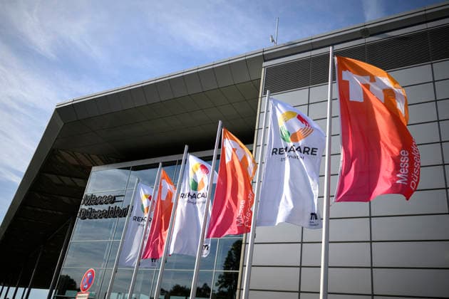 Feature: Banners and Flags in Front of the REHACARE Trade Fair for Rehabilitation and Care Exhibition Center, September 23–26, 2026, in Düsseldorf, Germany