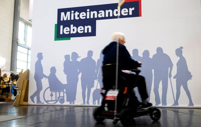 Feature, Slogan: Living Together with the Shadows of Different People, with a person in a wheelchair in the foreground. REHACARE Trade Fair for Rehabilitation and Care, September 23–26, 2026, in Düsseldorf, Germany. Trade Fair