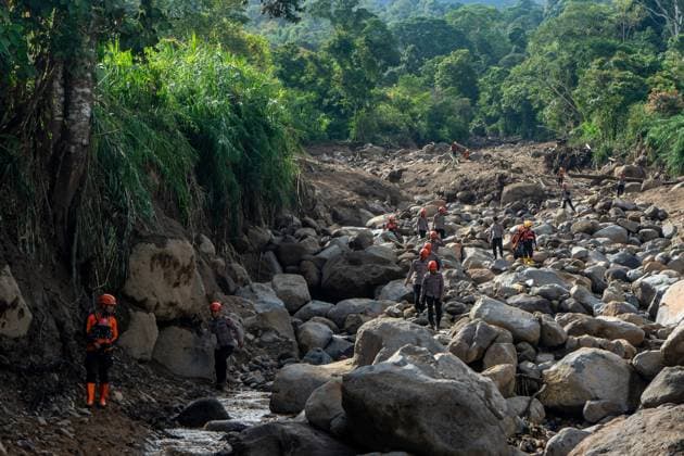 September 23, 2026, Solok Regency, Indonesia: SOLOK, WEST SUMATRA, INDONESIA, SEPTEMBER 23, 2026: Members of a joint search and rescue team comb an area affected by flash flooding in Arosuka, Solok, West Sumatra, as operations continue to locate a missing resident. Search teams from Indonesiaâ€⠢s National Search and Rescue Agency (BASARNAS), working alongside local residents, are searching for 59-year-old Agusral, who was reported missing after being swept away by floodwaters on September 21. Search efforts focused on several locations along the path of flood debris and a nearby river. Solok Regency Indonesia - ZUMAq101 20260923_zna_q101_020 Copyright: xWawanxKurniawanx