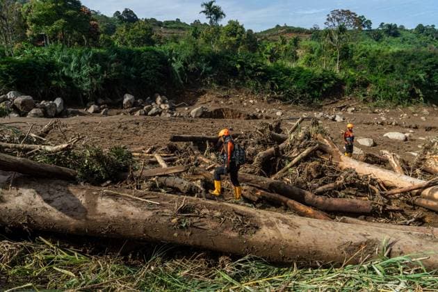 September 23, 2026, Solok Regency, Indonesia: SOLOK, WEST SUMATRA, INDONESIA, SEPTEMBER 23, 2026: Members of a joint search and rescue team comb an area affected by flash flooding in Arosuka, Solok, West Sumatra, as operations continue to locate a missing resident. Search teams from Indonesiaâ€⠢s National Search and Rescue Agency (BASARNAS), working alongside local residents, are searching for 59-year-old Agusral, who was reported missing after being swept away by floodwaters on September 21. Search efforts focused on several locations along the path of flood debris and a nearby river. Solok Regency Indonesia - ZUMAq101 20260923_zna_q101_025 Copyright: xWawanxKurniawanx