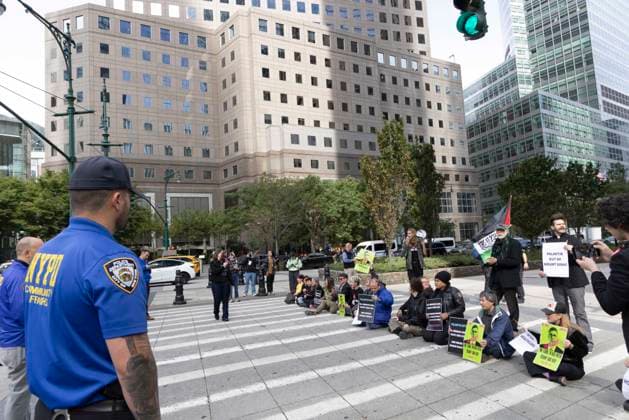 September 23, 2026, New York, New York, USA: NYPD moves in to arrest demonstrators blocking traffic on the West Side Highway. ACT UP NY leads a coalition of organizations blockading the entrance to 1 WTC and later on the Highway, demonstrating under the banner AI OUT OF OUR HEALTHCARE! PALANTIR OUT OF MOUNT SINAI! as the Newsweek AI Health Summit is held inside the building and a keynote speaker is Dr. Brendan Carr, (not pictured) CEO of Mount Sinai. Approximately 20 protesters are arrested. Part of the MONEY FOR AIDS and HEALTHCARE! NOT FOR ICE and WARFARE! ACT UP (AIDS Coalition To Unleash Power) campaign, demonstrators denounce Mount Sinai s contract with Palantir, a surveillance, data analytics and military tech company. New York USA - ZUMAr174 20260923_znp_r174_040 Copyright: xGinaxMxRandazzox