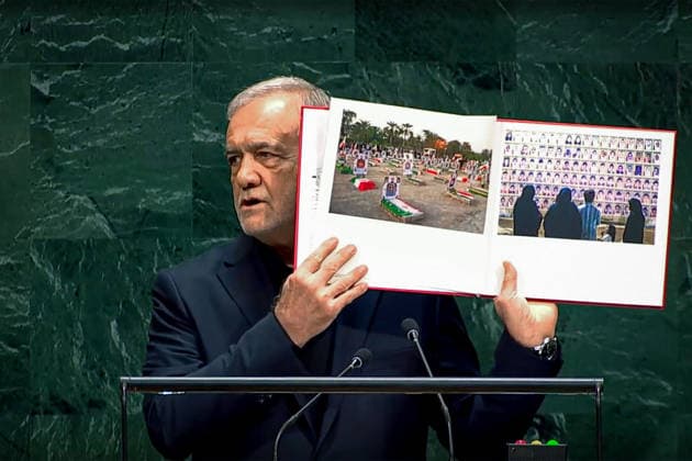 September 23, 2026, New York, United States: Iranian President Masoud Pezeshkian holds open a display containing memorial photographs during his address to the 81st United Nations General Assembly at United Nations headquarters in New York City, United States, on September 23, 2026. A United Nations fact-finding mission said it had reasonable grounds to believe U.S. forces were responsible for the February 28 strike on the Shajareh Tayyebeh Primary School in Minab, which it said killed more than 150 people, including 120 children; the United States rejected the mission s findings. New York USA - ZUMAi98_ 20260923_zih_i98_002 Copyright: xIranianxPresidencyx
