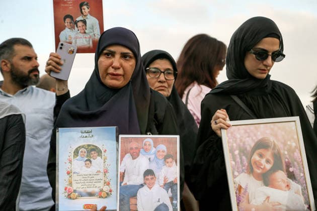 September 23, 2026, Beirut, Beirut, Lebanon: Lebanese mothers hold back their tears as they carry pictures of their children who died in war between Israel and pro-Iranian Hezbollah during a candle vigil ceremony in Beirut. Lebanese lawmaker Inaya Ezzeddine, who chairs the Lebanese parliamentÃ¢â‚¬â ¢s Women and Children Committee, said Ã¢â‚¬oenearly 800 children were killed during the two Israeli wars in 2024 and 2026Ã¢â‚¬Â, and around 360,000 displaced. Beirut Lebanon  - ZUMAn313 20260923_zip_n313_009 Copyright: xMarwanxNaamanix