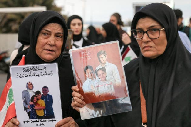 September 23, 2026, Beirut, Beirut, Lebanon: Lebanese mothers hold back their tears as they carry pictures of their children who died in war between Israel and pro-Iranian Hezbollah during a candle vigil ceremony in Beirut. Lebanese lawmaker Inaya Ezzeddine, who chairs the Lebanese parliamentÃ¢â‚¬â ¢s Women and Children Committee, said Ã¢â‚¬oenearly 800 children were killed during the two Israeli wars in 2024 and 2026Ã¢â‚¬Â, and around 360,000 displaced. Beirut Lebanon  - ZUMAn313 20260923_zip_n313_010 Copyright: xMarwanxNaamanix
