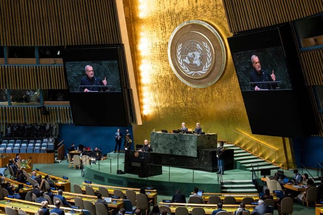 September 23, 2026, New York, United States: A wide view shows Iranian President Masoud Pezeshkian addressing the 81st United Nations General Assembly at United Nations headquarters in New York City, United States, on September 23, 2026. During the address, Pezeshkian displayed photographs of late Supreme Leader Ali Khamenei and images referring to civilian casualties in Minab and Lamerd. A United Nations fact-finding mission said it had reasonable grounds to believe U.S. forces were responsible for February 28 strikes on the Shajareh Tayyebeh Primary School in Minab and a sports complex in Lamerd; the United States rejected the mission s findings, and U.S. Central Command has separately denied striking Lamerd. New York USA - ZUMAi98_ 20260923_zih_i98_018 Copyright: xIranianxPresidencyx