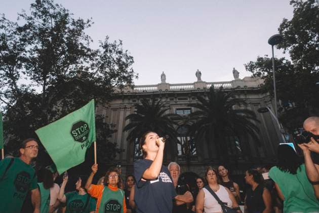 September 23, 2026, Barcelona, Catalonia, Spain: September 23, 2026, Barcelona, Spain: A protester shouts among union flags in front of the Government Delegation building. Hundreds of people gathered in front of the Spanish Government Delegation in Catalonia, on Mallorca Street in Barcelona, at a protest against evictions called by tenants and housing unions, including the Sindicat de Llogateres, the Barcelona Tenants Union. The protest followed the eviction that morning in Madrid of MARICARMEN, an 87-year-old woman forced out of the rented flat where she had lived for seventy years, and the death of OLGA, a woman from L Hospitalet de Llobregat who took her own life after being evicted. The unions warned that they will call a general stri - ZUMAs392 20260923_zip_s392_013 Copyright: xFabianxSuspensivox