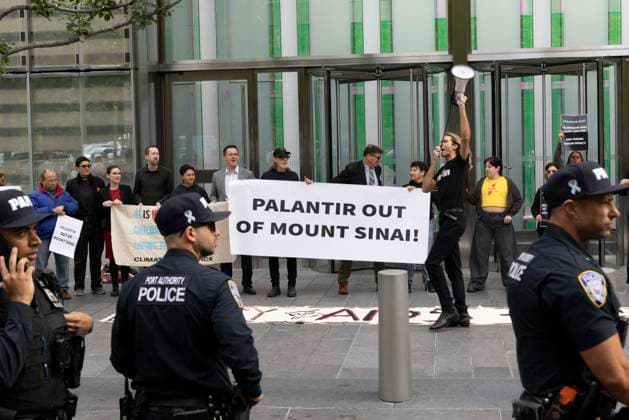 September 23, 2026, New York, New York, USA: ACT UP NY leads a coalition of organizations blockading the entrance to 1 WTC and later blocking traffic on the West Side Highway demonstrating under the banner AI OUT OF OUR HEALTHCARE! PALANTIR OUT OF MOUNT SINAI! as the Newsweek AI Health Summit is held inside the building and a keynote speaker is Dr. Brendan Carr, (not pictured) CEO of Mount Sinai. Approximately 20 protesters are arrested by NYPD. Part of the MONEY FOR AIDS and HEALTHCARE! NOT FOR ICE and WARFARE! ACT UP (AIDS Coalition To Unleash Power) campaign, demonstrators denounce Mount Sinai s contract with Palantir, a surveillance, data analytics and military tech company. Protesters chant and hold banners and signs that read New Y  - ZUMAr174 20260923_znp_r174_011 Copyright: xGinaxMxRandazzox