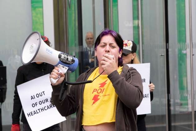 September 23, 2026, New York, New York, USA: ACT UP NY leads a coalition of organizations blockading the entrance to 1 WTC and later blocking traffic on the West Side Highway demonstrating under the banner AI OUT OF OUR HEALTHCARE! PALANTIR OUT OF MOUNT SINAI! as the Newsweek AI Health Summit is held inside the building and a keynote speaker is Dr. Brendan Carr, (not pictured) CEO of Mount Sinai. Approximately 20 protesters are arrested by NYPD. Part of the MONEY FOR AIDS and HEALTHCARE! NOT FOR ICE and WARFARE! ACT UP (AIDS Coalition To Unleash Power) campaign, demonstrators denounce Mount Sinai s contract with Palantir, a surveillance, data analytics and military tech company. New York USA  - ZUMAr174 20260923_znp_r174_014 Copyright: xGinaxMxRandazzox