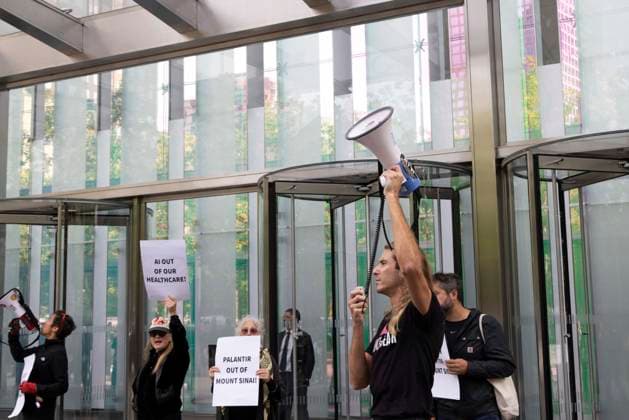 September 23, 2026, New York, New York, USA: ACT UP NY leads a coalition of organizations blockading the entrance to 1 WTC and later blocking traffic on the West Side Highway demonstrating under the banner AI OUT OF OUR HEALTHCARE! PALANTIR OUT OF MOUNT SINAI! as the Newsweek AI Health Summit is held inside the building and a keynote speaker is Dr. Brendan Carr, (not pictured) CEO of Mount Sinai. Approximately 20 protesters are arrested by NYPD. Part of the MONEY FOR AIDS and HEALTHCARE! NOT FOR ICE and WARFARE! ACT UP (AIDS Coalition To Unleash Power) campaign, demonstrators denounce Mount Sinai s contract with Palantir, a surveillance, data analytics and military tech company. New York USA  - ZUMAr174 20260923_znp_r174_015 Copyright: xGinaxMxRandazzox