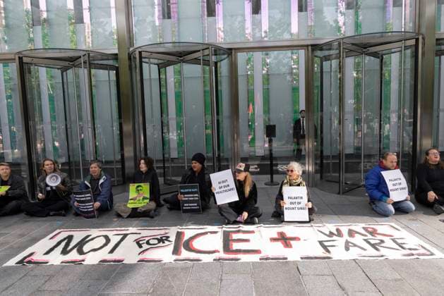 September 23, 2026, New York, New York, USA: ACT UP NY leads a coalition of organizations blockading the entrance to 1 WTC and later blocking traffic on the West Side Highway demonstrating under the banner AI OUT OF OUR HEALTHCARE! PALANTIR OUT OF MOUNT SINAI! as the Newsweek AI Health Summit is held inside the building and a keynote speaker is Dr. Brendan Carr, (not pictured) CEO of Mount Sinai. Approximately 20 protesters are arrested by NYPD. Part of the MONEY FOR AIDS and HEALTHCARE! NOT FOR ICE and WARFARE! ACT UP (AIDS Coalition To Unleash Power) campaign, demonstrators denounce Mount Sinai s contract with Palantir, a surveillance, data analytics and military tech company. New York USA  - ZUMAr174 20260923_znp_r174_021 Copyright: xGinaxMxRandazzox