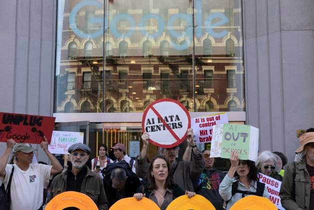 September 23, 2026, New York, New York, USA: A coalition of climate groups hold a family friendly singing demonstration outside GoogleÃ¢â‚¬â ¢s offices in ManhattanÃ¢â‚¬â ¢s Chelsea neighborhood protesting Google for embedding AI in educational tools and building gas powered data centers fueling the climate crisis. People hold signs that read red circle slash (no) AI DATA CENTERS AI OUT OF SCHOOLS UNPLUG Google. The event is part of the Unplug AI Week of Action during Climate Week NYC. Organizers call for a pause on advanced AI development and data center expansion and a national moratorium on the use of AI in schools. New York USA - ZUMAr174 20260923_znp_r174_057 Copyright: xGinaxMxRandazzox