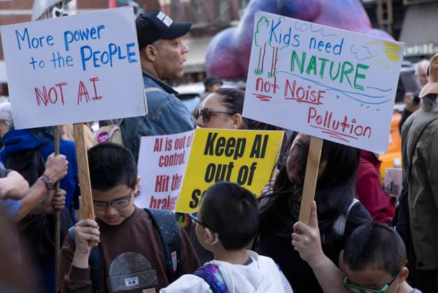 September 23, 2026, New York, New York, USA: A coalition of climate groups hold a family friendly singing demonstration outside GoogleÃ¢â‚¬â ¢s offices in ManhattanÃ¢â‚¬â ¢s Chelsea neighborhood protesting Google for embedding AI in educational tools and building gas powered data centers fueling the climate crisis. People hold signs that read More power to the People NOT AI Kids need NATURE not Noise Pollution AI is out of control. The event is part of the Unplug AI Week of Action during Climate Week NYC. Organizers call for a pause on advanced AI development and data center expansion and a national moratorium on the use of AI in schools. New York USA  - ZUMAr174 20260923_znp_r174_067 Copyright: xGinaxMxRandazzox