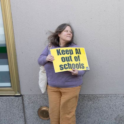 September 23, 2026, New York, New York, USA: A person stands outside GoogleÃ¢â‚¬â ¢s offices in ManhattanÃ¢â‚¬â ¢s Chelsea neighborhood holding a sign that reads Keep AI out of schools. A coalition of climate groups hold a family friendly singing demonstration protesting Google for embedding AI in educational tools and building gas powered data centers fueling the climate crisis. The event is part of the Unplug AI Week of Action during Climate Week NYC. Organizers call for a pause on advanced AI development and data center expansion and a national moratorium on the use of AI in schools. New York USA  - ZUMAr174 20260923_znp_r174_074 Copyright: xGinaxMxRandazzox