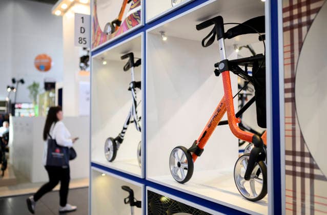 Feature: Visitors walk past walkers at REHACARE, the trade fair for rehabilitation and care, September 23–26, 2026, in Düsseldorf, Germany