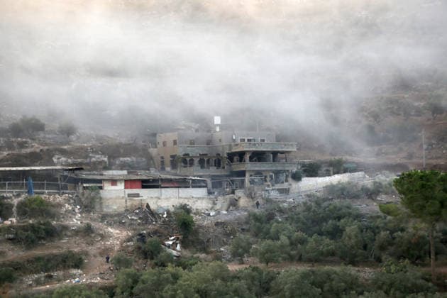 September 24, 2026, Nablus, West Bank, Palestine: Smoke rises as Israeli forces demolish the home of Palestinian prisoner Dawas Hassouna. Israeli army forces demolished the family home of Palestinian prisoner Dawas Hassoun, who is accused of killing an Israeli settler, in the village of Beit Marin, northwest of Nablus in the West Bank. Nablus Palestine  - ZUMAs197 20260924_aaa_s197_004 Copyright: xNasserxIshtayehx