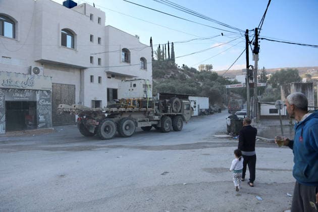 September 24, 2026, Nablus, West Bank, Palestine: Israeli military vehicles withdraw after completing the demolition of the family home of Palestinian prisoner Dawas Hassoun. Israeli army forces demolished the family home of Palestinian prisoner Dawas Hassoun, who is accused of killing an Israeli settler, in the village of Beit Marin, northwest of Nablus in the West Bank. Nablus Palestine  - ZUMAs197 20260924_aaa_s197_016 Copyright: xNasserxIshtayehx