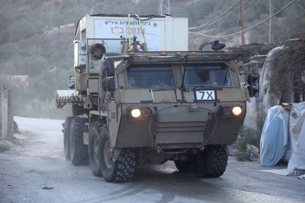 September 24, 2026, Nablus, West Bank, Palestine: Israeli military vehicles withdraw after completing the demolition of the family home of Palestinian prisoner Dawas Hassoun. Israeli army forces demolished the family home of Palestinian prisoner Dawas Hassoun, who is accused of killing an Israeli settler, in the village of Beit Marin, northwest of Nablus in the West Bank. Nablus Palestine  - ZUMAs197 20260924_aaa_s197_024 Copyright: xNasserxIshtayehx