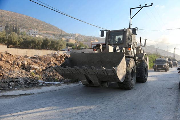 September 24, 2026, Nablus, West Bank, Palestine: Israeli military vehicles withdraw after completing the demolition of the family home of Palestinian prisoner Dawas Hassoun. Israeli army forces demolished the family home of Palestinian prisoner Dawas Hassoun, who is accused of killing an Israeli settler, in the village of Beit Marin, northwest of Nablus in the West Bank. Nablus Palestine  - ZUMAs197 20260924_aaa_s197_033 Copyright: xNasserxIshtayehx