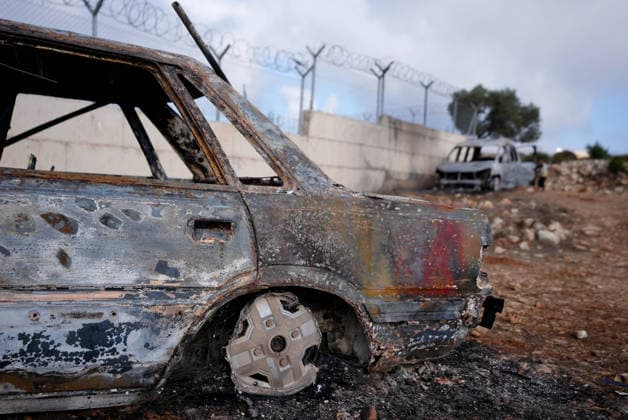 Israeli settlers set fire to Palestinian cars in attack on Atara town near Ramallah RAMALLAH, WEST BANK, PALESTINE - SEPTEMBER 24: Palestinian children stand on and play inside the charred remains of burned vehicles following an attack by Israeli settlers in the town of Atara, north of Ramallah in West Bank, Palestine on September 24, 2026. Israeli settlers raided the town and set fire to two cars belonging to local Palestinians, leaving them completely destroyed. Issam Rimawi Anadolu Ramallah West Bank. Editorial use only. Please get in touch for any other usage.  Copyright: x2026xAnadoluxIssamxRimawix