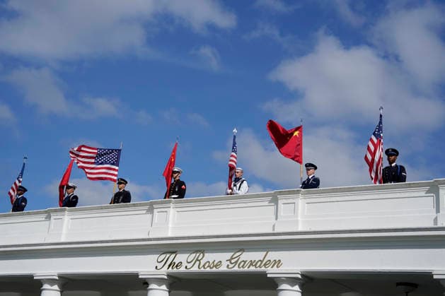 Members of a military honor guard stand at attention as Chinese President Xi Jinping and his wife Peng Liyuan are greeted by President Donald Trump and First Lady Melania Trump as they arrive for a state visit at the White House in Washington DC on Thursday, September 24, 2026. Xi is on a three-day state visit to the U.S. and will hold talks with U.S. officials on tariffs, AI, and other issues.  WAX20260924703 BONNIExCASH
