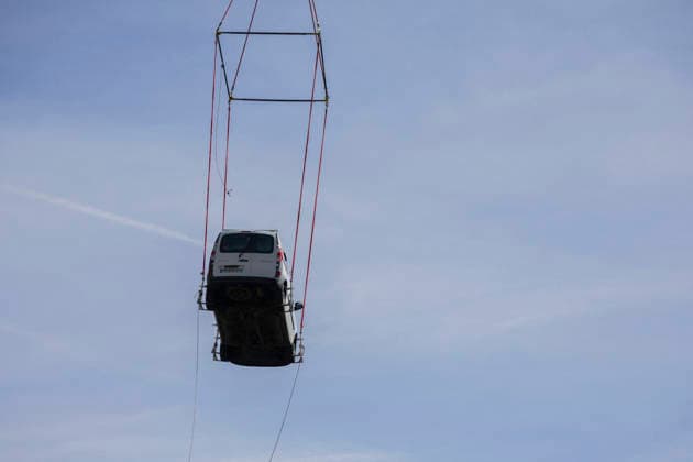 Vehicles Evacuated by Helicopter After Floods - France A dark van hangs vertically beneath the helicopter during its evacuation. Nine vehicles stranded at the Pre de Madame Carle were evacuated by helicopter after floods on August 28 destroyed several sections of the RD204T access road. Ailefroide, Vallouise-Pelvoux, Hautes-Alpes, France, September 24, 2026. Photo by Thibaut Durand ABACAPRESS.COM vallouise-pelvoux PROVENCE-ALPES-COTE D AZUR France  Copyright: xDurandxThibaut ABACAx