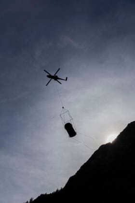Vehicles Evacuated by Helicopter After Floods - France A dark van is silhouetted against the sky beneath the helicopter. Nine vehicles stranded at the Pre de Madame Carle were evacuated by helicopter after floods on August 28 destroyed several sections of the RD204T access road. Ailefroide, Vallouise-Pelvoux, Hautes-Alpes, France, September 24, 2026. Photo by Thibaut Durand ABACAPRESS.COM vallouise-pelvoux PROVENCE-ALPES-COTE D AZUR France  Copyright: xDurandxThibaut ABACAx