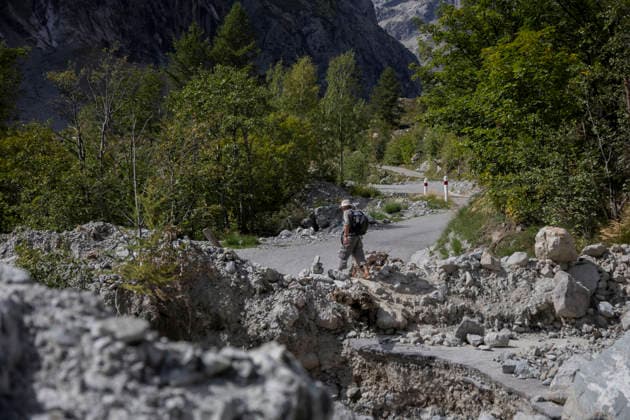 Vehicles Evacuated by Helicopter After Floods - France A person walks along an isolated section of the RD204T beyond a deep washout. Nine vehicles stranded at the Pre de Madame Carle were evacuated by helicopter after floods on August 28 destroyed several sections of the RD204T access road. Ailefroide, Vallouise-Pelvoux, Hautes-Alpes, France, September 24, 2026. Photo by Thibaut Durand ABACAPRESS.COM vallouise-pelvoux PROVENCE-ALPES-COTE D AZUR France  Copyright: xDurandxThibaut ABACAx