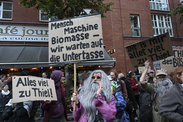 Protest held against Peter Thiel receiving 2026 Axel Springer Award BERLIN, GERMANY - SEPTEMBER 24: Protesters gather near the Axel Springer building, against US investor and Palantir co-founder Peter Thiel receiving the 2026 Axel Springer Award. Demonstrators criticize Thiel and Palantir s activities and carry various banners and placards, in Berlin, capital of Germany, on September 24, 2026. Halil Sagirkaya Anadolu Berlin Germany. Editorial use only. Please get in touch for any other usage.  Copyright: x2026xAnadoluxHalilxSagirkayax