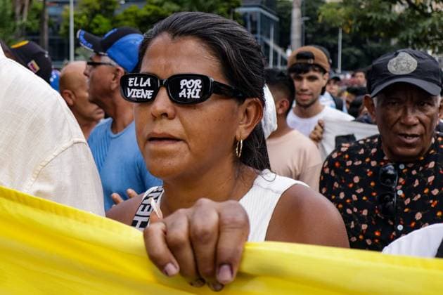 September 24, 2026, Caracas, Venezuela (Bolivarian Republic of: CARACAS, VENEZUELA, SEPTEMBER 24, 2026: Opposition supporters demonstrate in Caracas demanding that opposition leader MaroÂ­a Corina Machado be allowed to return to Venezuela and calling for new presidential elections. Protesters gathered at Plaza Venezuela before marching toward the headquarters of the National Electoral Council (CNE). Some demonstrators later occupied a section of the Gran Cacique Guaicaipuro highway near the Central University of Venezuela, disrupting traffic. Caracas Venezuela (Bolivarian Republic of  - ZUMAq101 20260924_zna_q101_182 Copyright: xMarioxFloresx