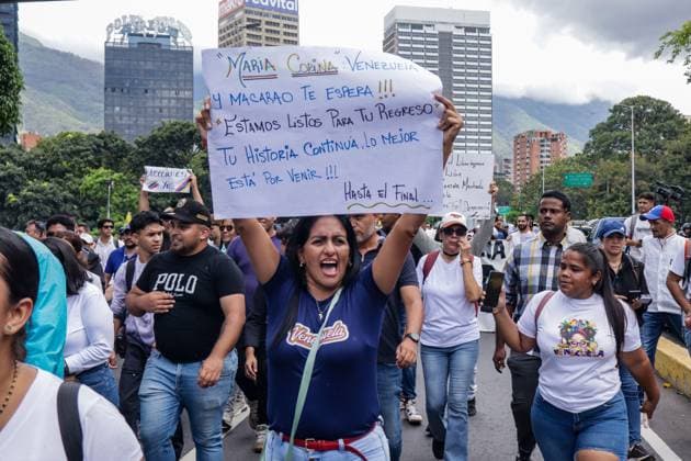 September 24, 2026, Caracas, Venezuela (Bolivarian Republic of: CARACAS, VENEZUELA, SEPTEMBER 24, 2026: Opposition supporters demonstrate in Caracas demanding that opposition leader MaroÂ­a Corina Machado be allowed to return to Venezuela and calling for new presidential elections. Protesters gathered at Plaza Venezuela before marching toward the headquarters of the National Electoral Council (CNE). Some demonstrators later occupied a section of the Gran Cacique Guaicaipuro highway near the Central University of Venezuela, disrupting traffic. Caracas Venezuela (Bolivarian Republic of  - ZUMAq101 20260924_zna_q101_183 Copyright: xMarioxFloresx