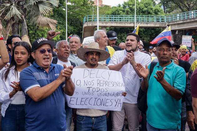 September 24, 2026, Caracas, Venezuela (Bolivarian Republic of: CARACAS, VENEZUELA, SEPTEMBER 24, 2026: Opposition supporters demonstrate in Caracas demanding that opposition leader MaroÂ­a Corina Machado be allowed to return to Venezuela and calling for new presidential elections. Protesters gathered at Plaza Venezuela before marching toward the headquarters of the National Electoral Council (CNE). Some demonstrators later occupied a section of the Gran Cacique Guaicaipuro highway near the Central University of Venezuela, disrupting traffic. Caracas Venezuela (Bolivarian Republic of  - ZUMAq101 20260924_zna_q101_198 Copyright: xMarioxFloresx