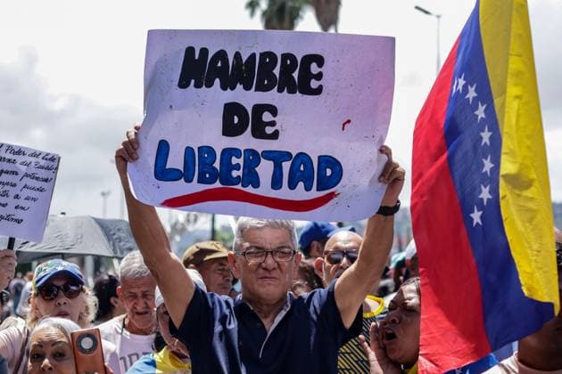September 24, 2026, Caracas, Venezuela (Bolivarian Republic of: CARACAS, VENEZUELA, SEPTEMBER 24, 2026: Opposition supporters demonstrate in Caracas demanding that opposition leader MaroÂ­a Corina Machado be allowed to return to Venezuela and calling for new presidential elections. Protesters gathered at Plaza Venezuela before marching toward the headquarters of the National Electoral Council (CNE). Some demonstrators later occupied a section of the Gran Cacique Guaicaipuro highway near the Central University of Venezuela, disrupting traffic. Caracas Venezuela (Bolivarian Republic of  - ZUMAq101 20260924_zna_q101_199 Copyright: xMarioxFloresx