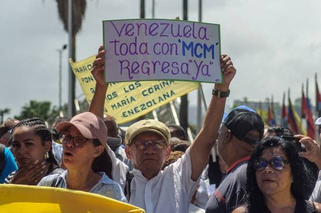 September 24, 2026, Caracas, Venezuela (Bolivarian Republic of: CARACAS, VENEZUELA, SEPTEMBER 24, 2026: Opposition supporters demonstrate in Caracas demanding that opposition leader MaroÂ­a Corina Machado be allowed to return to Venezuela and calling for new presidential elections. Protesters gathered at Plaza Venezuela before marching toward the headquarters of the National Electoral Council (CNE). Some demonstrators later occupied a section of the Gran Cacique Guaicaipuro highway near the Central University of Venezuela, disrupting traffic. Caracas Venezuela (Bolivarian Republic of  - ZUMAq101 20260924_zna_q101_200 Copyright: xMarioxFloresx