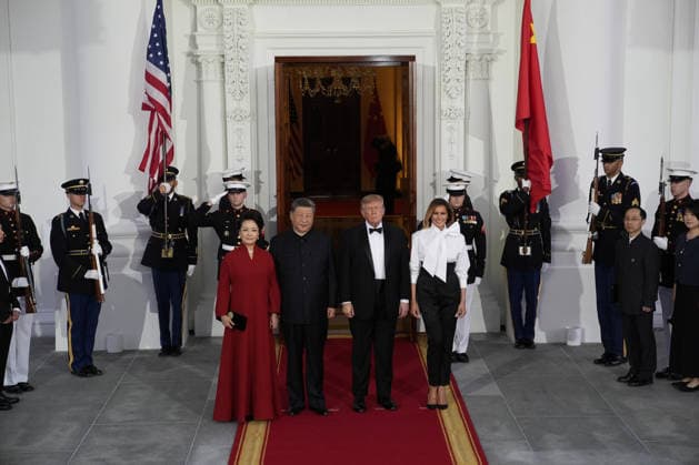 Chinese President Xi Jinping and his wife Peng Liyuan stand with President Donald Trump and First Lady Melania Trump as they arrive for a state dinner at the White House in Washington DC on Thursday, September 24, 2026.  WAX202609249754 YURIxGRIPAS