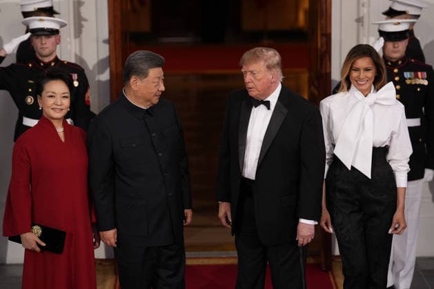 Chinese President Xi Jinping and his wife Peng Liyuan stand with President Donald Trump and First Lady Melania Trump as they arrive for a state dinner at the White House in Washington DC on Thursday, September 24, 2026.  WAX202609249756 YURIxGRIPAS