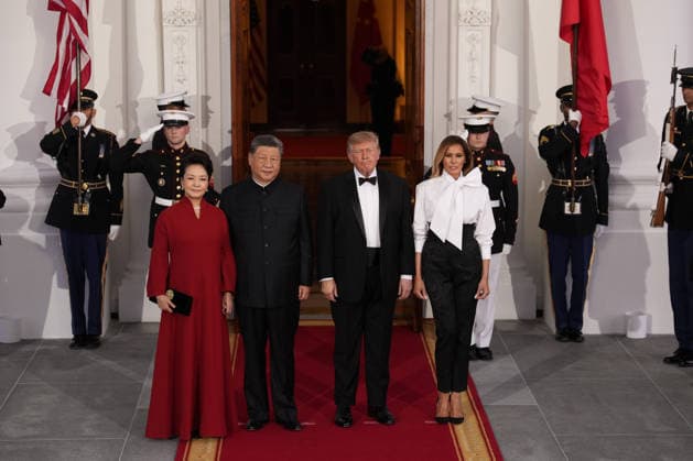 Chinese President Xi Jinping and his wife Peng Liyuan stand with President Donald Trump and First Lady Melania Trump as they arrive for a state dinner at the White House in Washington DC on Thursday, September 24, 2026.  WAX202609249764 YURIxGRIPAS