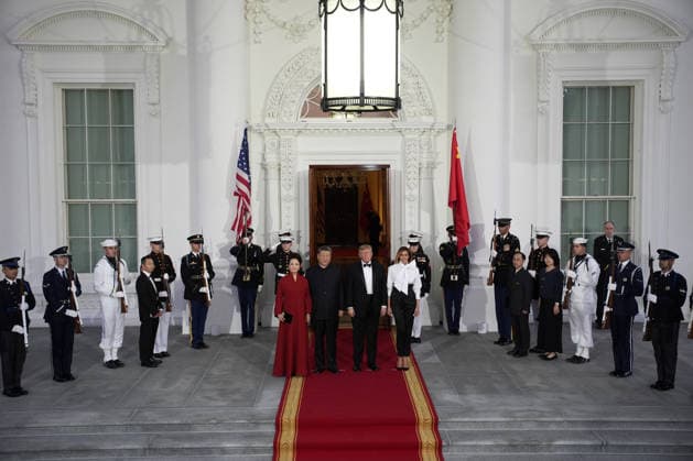 Chinese President Xi Jinping and his wife Peng Liyuan stand with President Donald Trump and First Lady Melania Trump as they arrive for a state dinner at the White House in Washington DC on Thursday, September 24, 2026.  WAX202609249766 YURIxGRIPAS